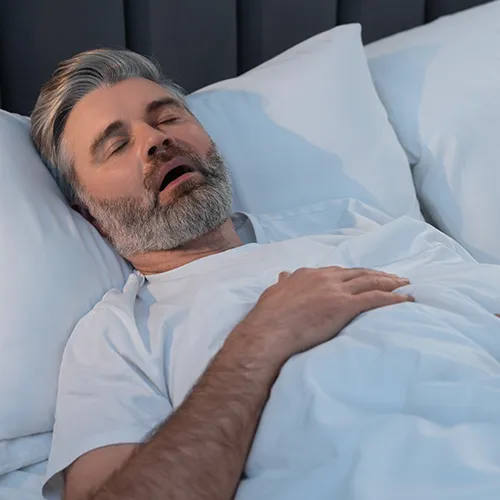 man sleeping on his back