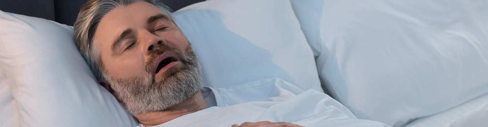 man sleeping on his back